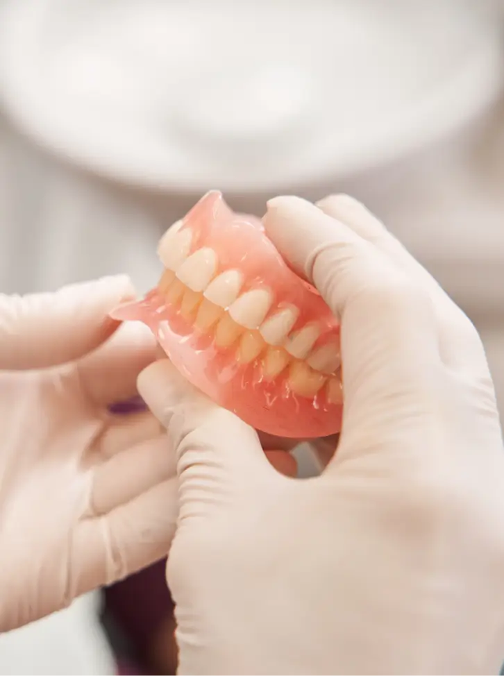 Handling a set of dentures