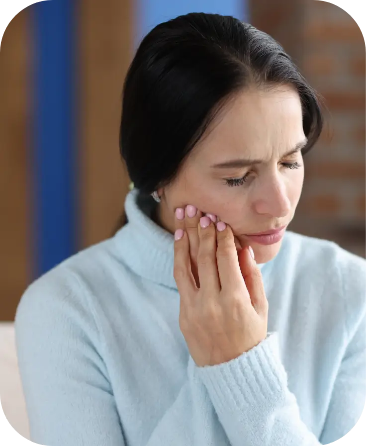 Woman suffering from jaw pain