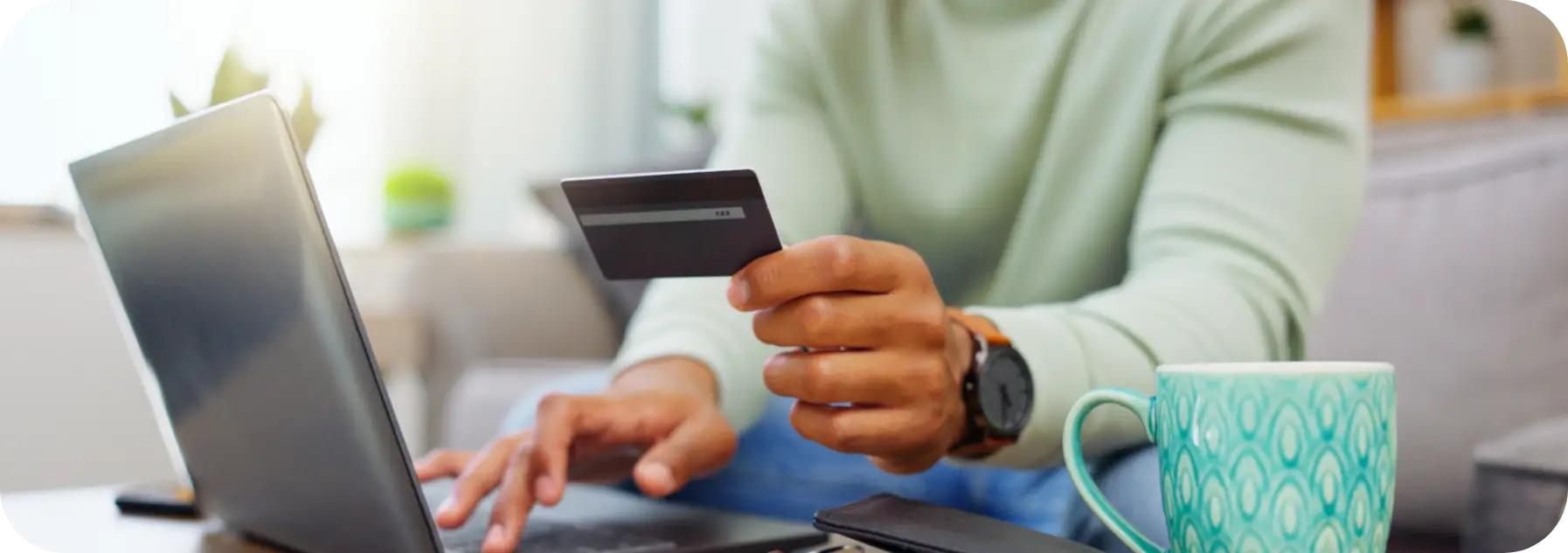 Person making a payment online with a credit card