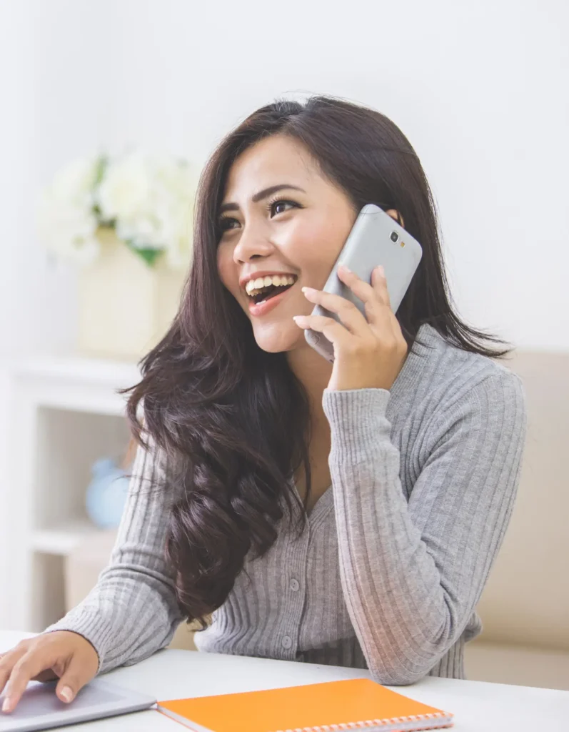 Female patient making an appointment over the phone